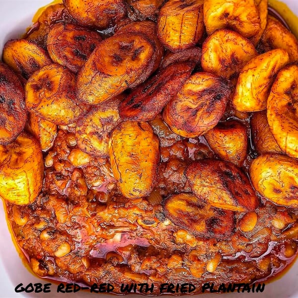 Close-up of Gobe Red-Red with fried plantains, a traditional African dish from PRIXYS AFRICAN RESTAURANT.